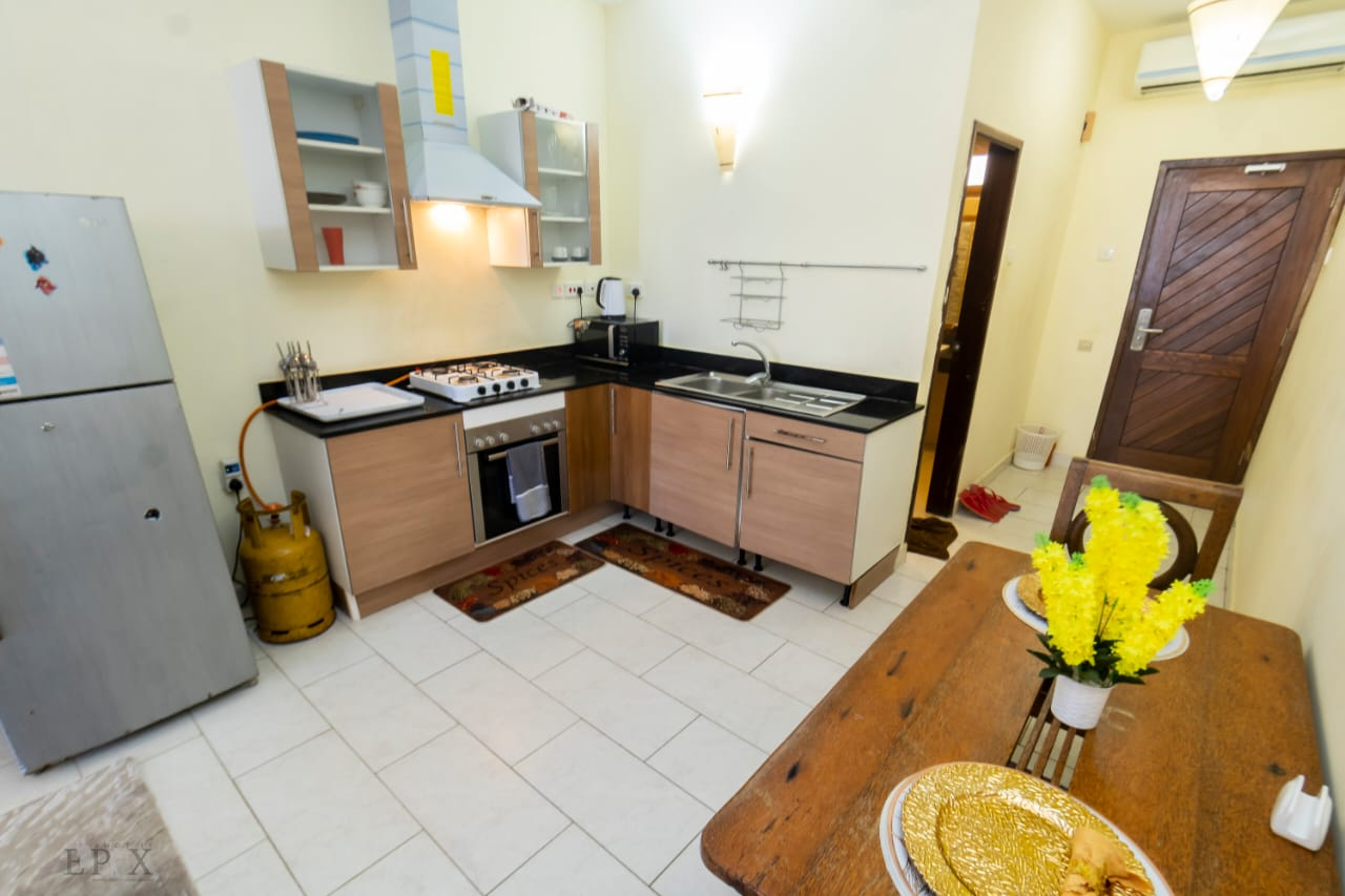 Kitchen and dining area in an AdetiEmpire studio apartment